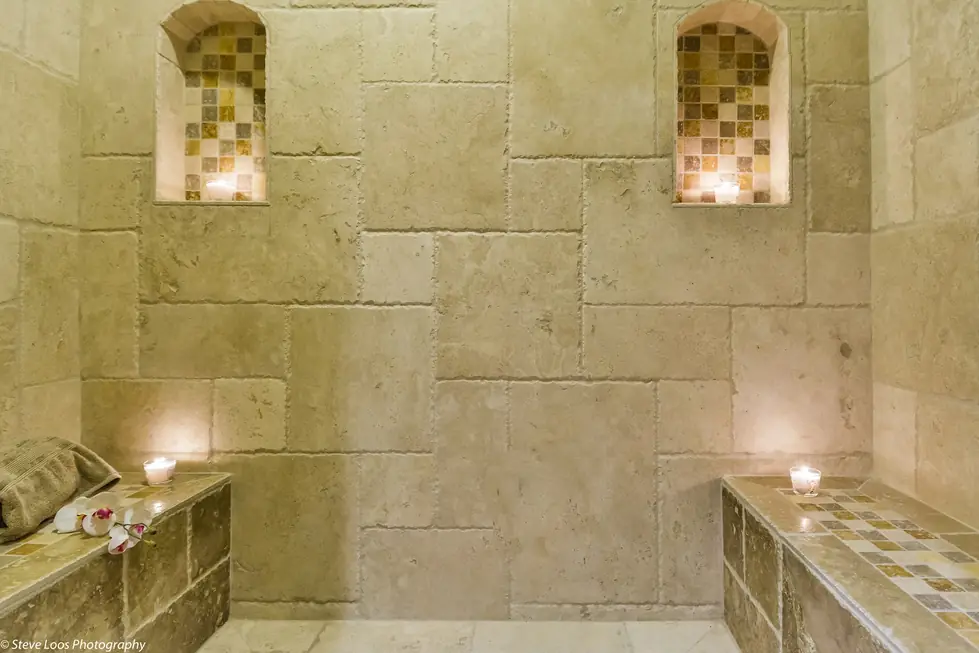The travertine steam room at Heaven Scent, candles in two tiled niches