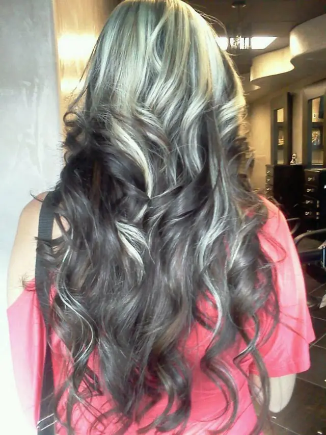 Long dark waves with silver and blonde streaks, finished at Heaven Scent