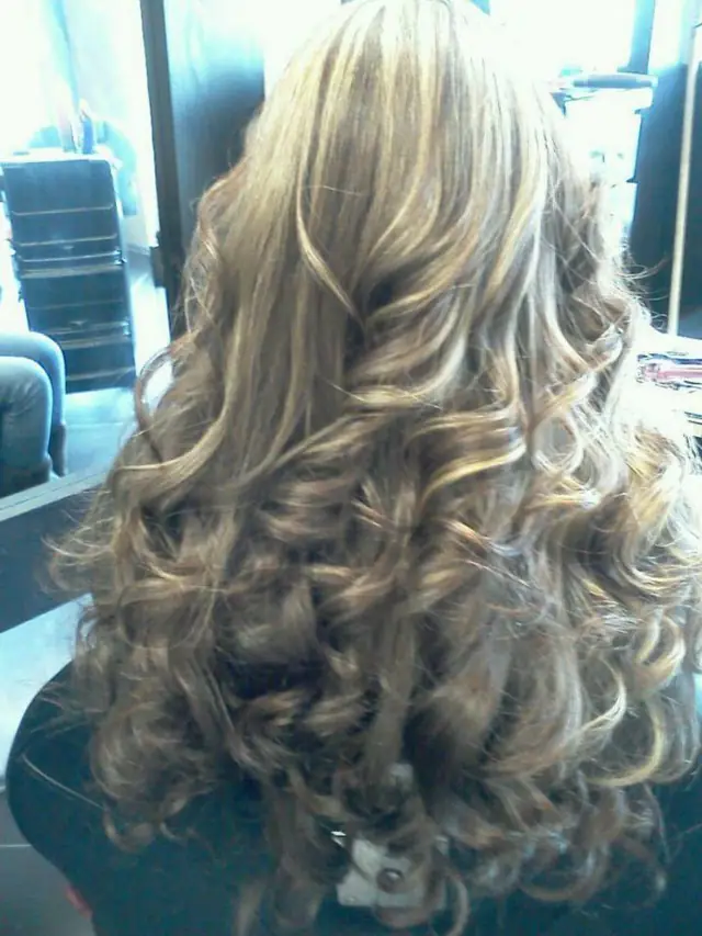 Blonde highlighted curls, back view